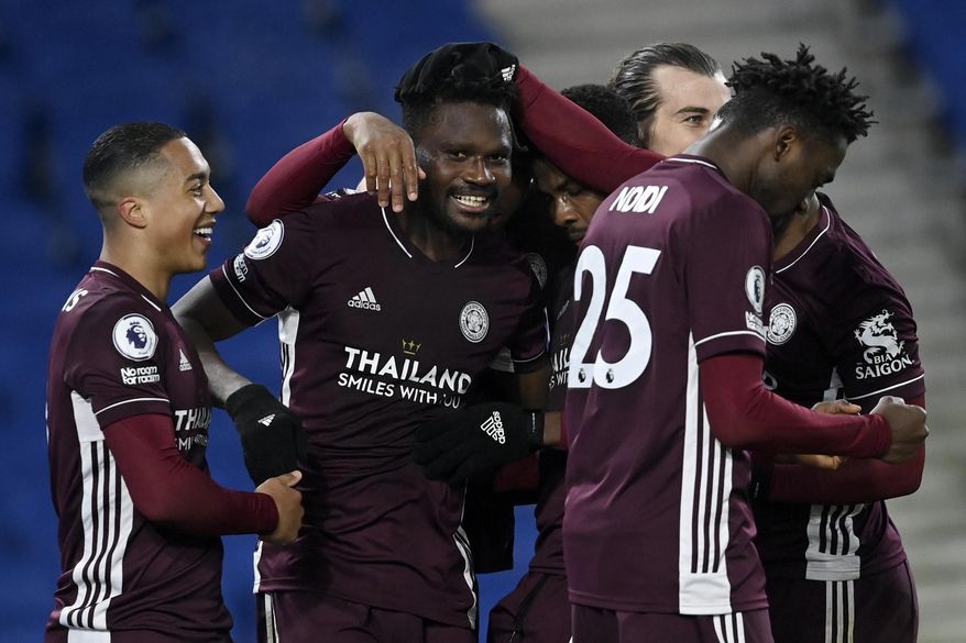 Leicester&#x27;s Daniel Amartey, 2nd right, is congratulated by his teammates after scoring his side&#x27;s second goal during the English Premier League soccer match between Brighton &amp;amp; Hove Albion and Leicester City at the AMEX Stadium in Brighton, England, Saturday, March 6, 2021. (Neil Hall/Pool via AP)