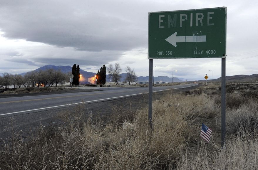 A sign points to the town of Empire, Nevada off the highway leading to Gerlach and the Black Rock Desert in this photo taken in 2010. The town about 90 miles north of Reno was where actress Frances McDormand's character sets out from in the award-winning film "Nomadland." (David B. Parker/The Reno Gazette-Journal via AP)