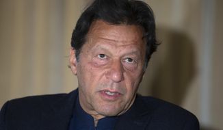 FILE - In this March 16, 2020 file photo, Prime Minister Imran Khan speaks during an interview in Islamabad, Pakistan. Prime Minister Khan handily won a vote of confidence from the National Assembly on Saturday, March 6, 2021, days after the embarrassing defeat of his ruling party’s key candidate in Senate elections. (AP Photo/B.K. Bangash, File)