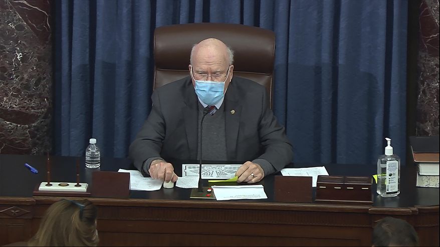 In this image from video, Sen. Patrick Leahy, D-Vt., the president pro tempore of the Senate, presides during debate on the Senate COVID-19 relief bill in the Senate at the U.S. Capitol in Washington, Saturday, March 6, 2021. (Senate Television via AP)