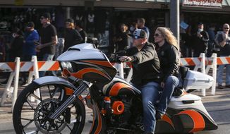 Bikers ride up and down Main Street in Daytona, Fla., during the start of Bike Week on Friday, March 5, 2021. (Sam Thomas /Orlando Sentinel via AP)