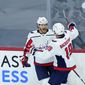 Washington Capitals&#39; Nick Jensen (3) and Nicklas Backstrom (19) celebrate after Jensen&#39;s goal during the third period of an NHL hockey game against the Philadelphia Flyers, Sunday, March 7, 2021, in Philadelphia. (AP Photo/Matt Slocum)