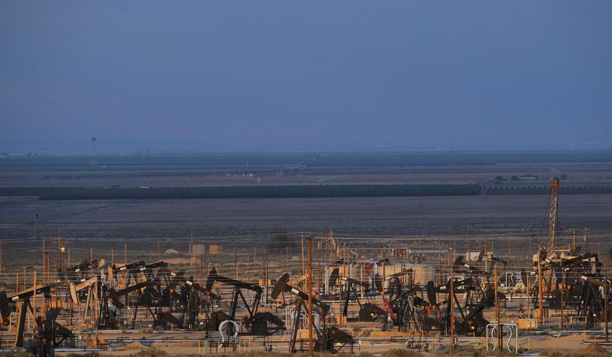 FILE - This May 1, 2018 file photo shows oil pump jacks in an oil field near Taft, Calif. California&#x27;s oil rich Kern County is voting on a revised plan that could permit tens of thousands of oil and gas wells in the next two decades. The plan had to be rewritten after environmental groups sued and a state appeals court found the county&#x27;s permit system could threaten the region&#x27;s air and water. (AP Photo/Jae C. Hong,File)