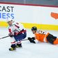Washington Capitals&#39; Alex Ovechkin (8) keeps the puck away from Philadelphia Flyers&#39; Shayne Gostisbehere (53) during the third period of an NHL hockey game, Sunday, March 7, 2021, in Philadelphia. (AP Photo/Matt Slocum)