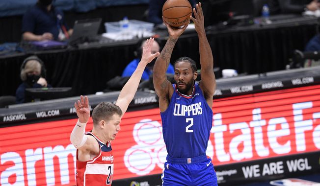 Los Angeles Clippers forward Kawhi Leonard (2) shoots against Washington Wizards center Moritz Wagner, left, during the second half of an NBA basketball game, Thursday, March 4, 2021, in Washington. (AP Photo/Nick Wass)