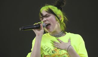 FILE - In this Oct. 5, 2019 photo, Billie Eilish performs during the first weekend of the Austin City Limits Music Festival in Zilker Park in Austin, Texas. Eilish will perform at this month&#39;s Grammy Awards. (Photo by Jack Plunkett/Invision/AP, File)