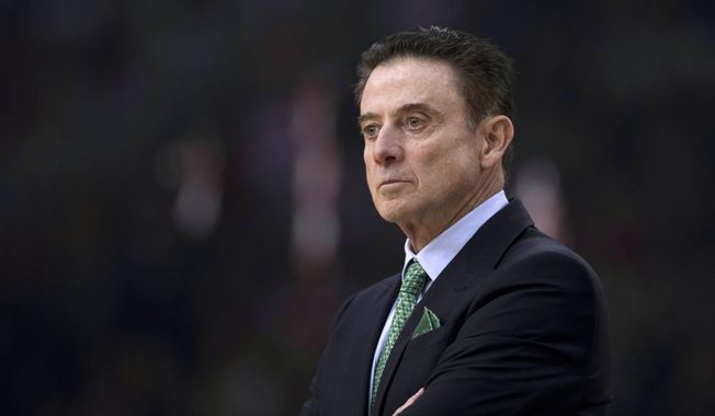 FILE - In this Jan. 4, 2019, file photo Panathinaikos coach Rick Pitino looks on during a Euroleague basketball match between Panathinaikos and Olympiakos in Piraeus near Athens. The coronavirus was already in town by the time Pitino arrived. It never fully let go of its grip around Iona. Forced to pause four times this season because of the virus, once for nearly two months, the Gaels need to win their conference tournament this week to make the NCAA Tournament.  (AP Photo/Petros Giannakouris, File)
