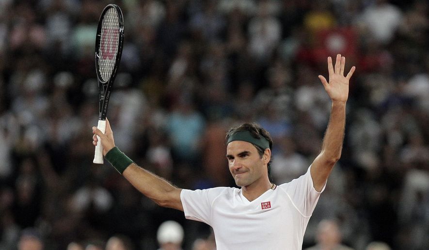 FILE - In this file photo dated Friday Feb. 7, 2020, Roger Federer thanks the crowd after winning 3 sets to 2 against Rafael Nadal in their exhibition tennis match held at the Cape Town Stadium in Cape Town, South Africa. The 20-time Grand Slam champion Roger Federer will face the winner of the match between Jeremy Chardy and Dan Evans in the Qatar Open next week in his first competition for more than a year. (AP Photo/Halden Krog, FILE)