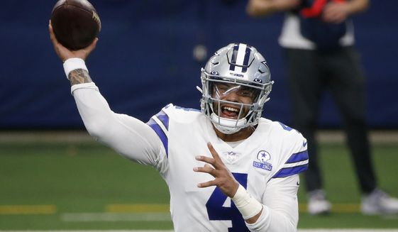 In this Oct. 11, 2020, file photo, Dallas Cowboys quarterback Dak Prescott throws a pass in the first half of an NFL football game against the New York Giants in Arlington, Texas. The Cowboys and Prescott have finally agreed on a contract two years after negotiations began with the star quarterback. The team the agreement was reached Monday, March 8, 2021, with further details to be announced. (AP Photo/Michael Ainsworth, File) **FILE**