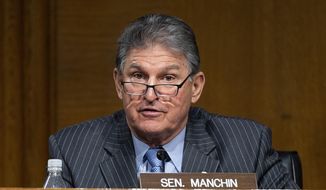 In this file photo, Sen. Joe Manchin, D-WVa., speaks during a hearing to examine the nomination of former Gov. Jennifer Granholm, D-Mich., as she testifies before the Senate Energy and Natural Resources Committee during a hearing to examine her nomination to be Secretary of Energy, Wednesday, Jan. 27, 2021, on Capitol Hill in Washington. (Jim Watson/Pool via AP)  ** FILE **