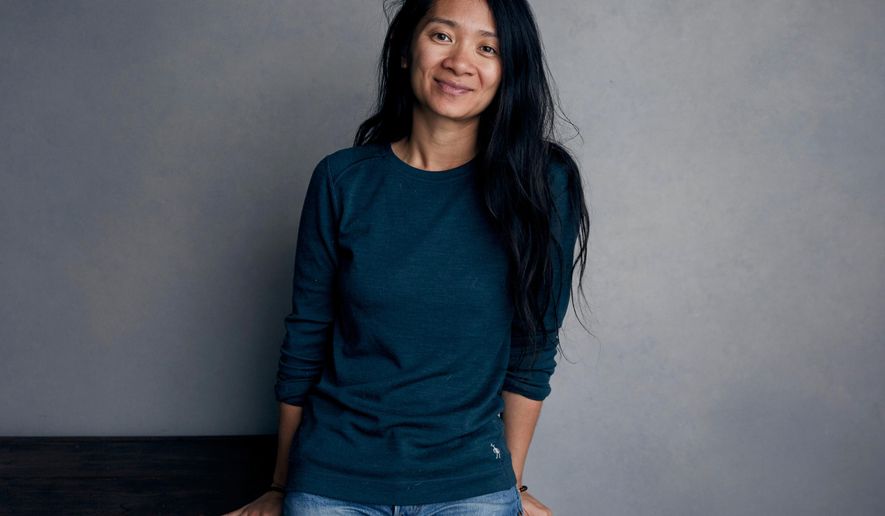 FILE - In this Jan. 22, 2018, file photo, Chloe Zhao poses for a portrait during the Sundance Film Festival in Park City, Utah.  Chloe Zhao&#39;s success as the first Asian woman and the second woman ever to win a Golden Globe for best director for her film “Nomadland” has not been met with universal applause in the country where she was born.(Photo by Taylor Jewell/Invision/AP, File)