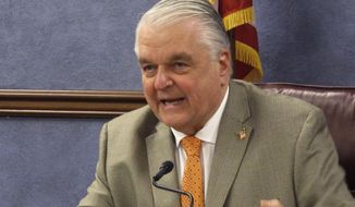 FILE - In this May 7, 2020, file photo, Nevada Gov. Steve Sisolak speaks during a news conference in Carson City, Nev. One year into the pandemic, Nevada Gov. Steve Sisolak is still attempting to strike the right balance between keeping the state&#39;s tourism industry afloat while also containing the virus. In an interview with the Associated Press, Sisolak said he plans to use Nevada&#39;s safety protocols as a selling point to bring tourists, conventions, and trade shows back to Las Vegas. (AP Photo/Scott Sonner, File)
