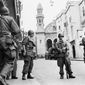 FILE - In this May 27, 1956 file photo, French troops seal off Algiers&#39; notorious casbah, 400-year-old teeming Arab quarter. French President Emmanuel Macron announced a decision to speed up the declassification of secret documents related to Algeria&#39;s seven-year war of independence from 1954 to 1962. (AP Photo, File)