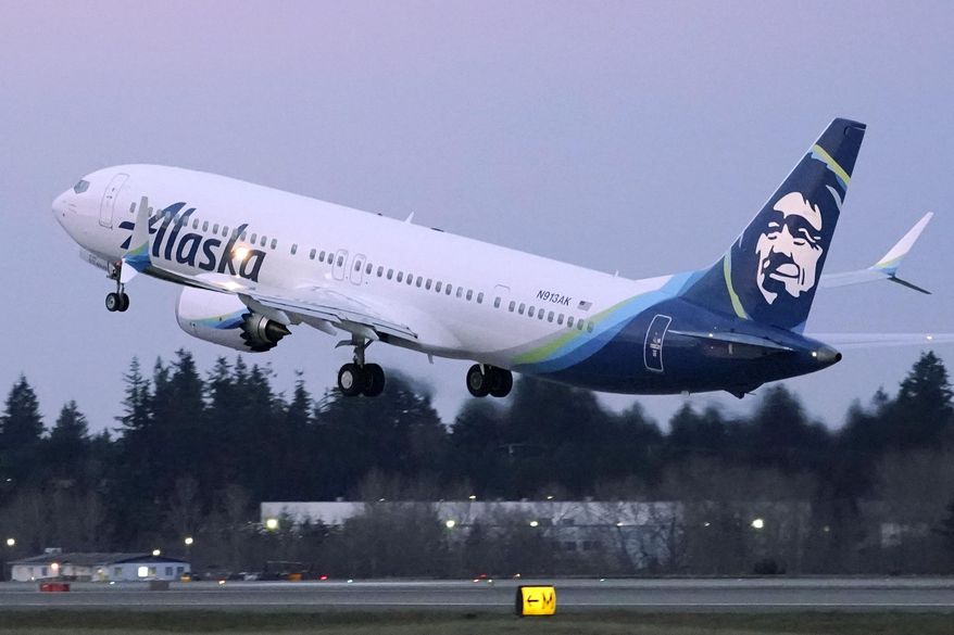 FILE - The first Alaska Airlines passenger flight on a Boeing 737-9 Max airplane takes off, Monday, March 1, 2021, on a flight to San Diego from Seattle-Tacoma International Airport in Seattle.   Boeing says it got more new orders than cancellations for planes in February.  Boeing said Tuesday, March 9, that it received 82 new orders and 51 cancellations last month, for a net gain of 31.    (AP Photo/Ted S. Warren, File)
