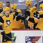 Pittsburgh Penguins&#39; Teddy Blueger (53) is greeted by teammates on the bench after scoring against the New York Rangers during the second period of an NHL hockey game Tuesday, March 9, 2021, in Pittsburgh. (AP Photo/Keith Srakocic)