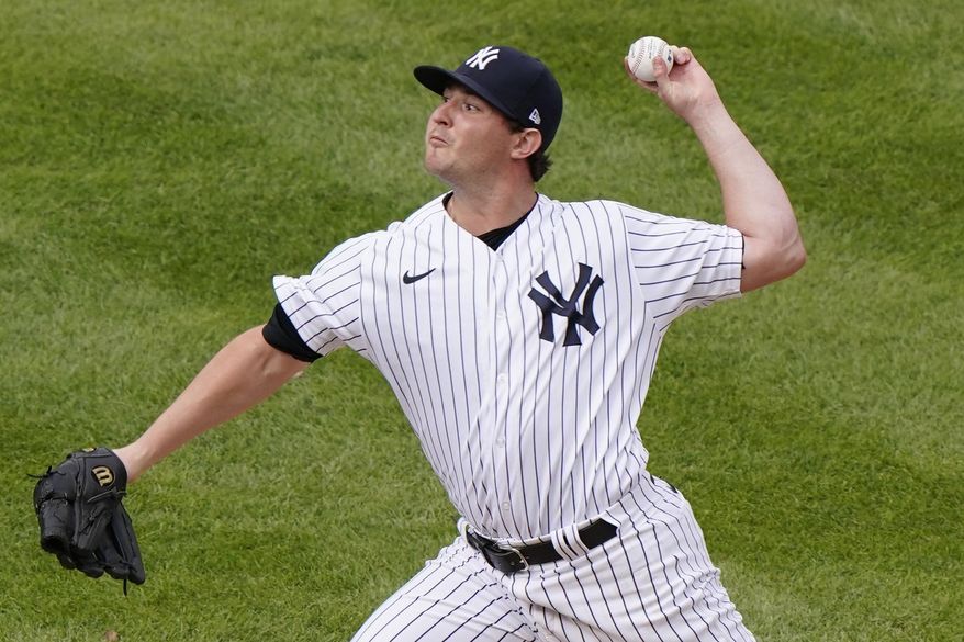 FILE - New York Yankees relief pitcher Zack Britton winds up during the eighth inning of a baseball game against the Baltimore Orioles in New York, in this Sunday, Sept. 13, 2020, file photo. Yankees left-hander Zack Britton is not throwing because of a sore pitching elbow, was to be examined by a doctor on Tuesday, March 9, 2021, and could miss the start of the season. (AP Photo/Kathy Willens, File)
