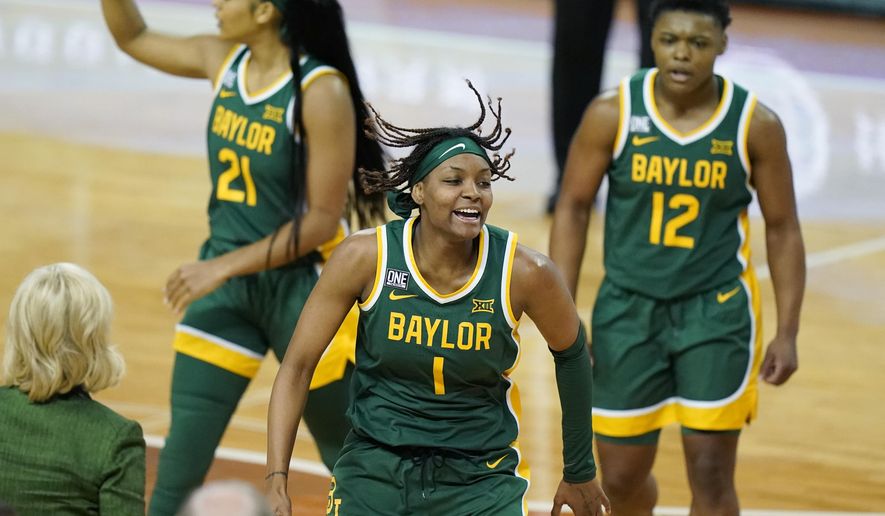 FILE - Baylor forward NaLyssa Smith (1) celebrates a score against Texas with teammates during the second half of an NCAA college basketball game in Austin, Texas, in this Monday, March 1, 2021, file photo. The Lady Bears take a 14-game winning streak into the Big-12 tournament. Junior forward NaLyssa Smith is the leading scorer for Baylor. (AP Photo/Eric Gay, File)
