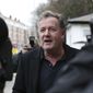 British television host Piers Morgan speaks to reporters outside his home in Kensington, central London, Wednesday March 10, 2021. Morgan quit the “Good Morning Britain” program on Tuesday after making controversial comments about the Duchess of Sussex. The U.K.’s media watchdog said earlier Tuesday it was launching an investigation into the show under its harm and offense rules after receiving more than 41,000 complaints about Morgan’s comments on Meghan. (Jonathan Brady/PA via AP)