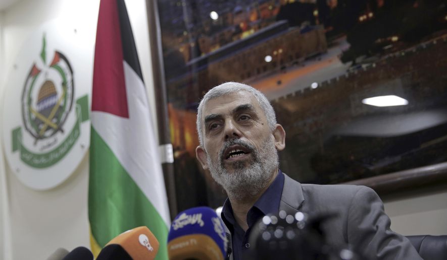 FILE - In this May 10, 2018 file photo, Yehiyeh Sinwar, the Hamas militant group&#x27;s leader in the Gaza Strip, speaks to foreign correspondents, in his office in Gaza City. A Hamas official said Wednesday,March 10, 2021, that Sinwar has been re-elected as the group’s top official in its Gaza Strip stronghold. Sinwar, who is close to the group’s hardline militant wing, fended off a challenge by Nizar Awadallah, one of its founders. (AP Photo/Khalil Hamra, File)