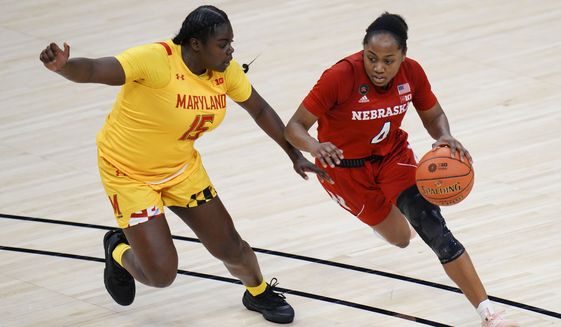 Nebraska guard Sam Haiby (4) brings the ball up court in front of Maryland guard Ashley Owusu (15) in the second half of an NCAA college basketball game in the quarterfinals of the Big Ten Conference tournament in Indianapolis, Thursday, March 11, 2021. Maryland won 83-73. (AP Photo/AJ Mast)