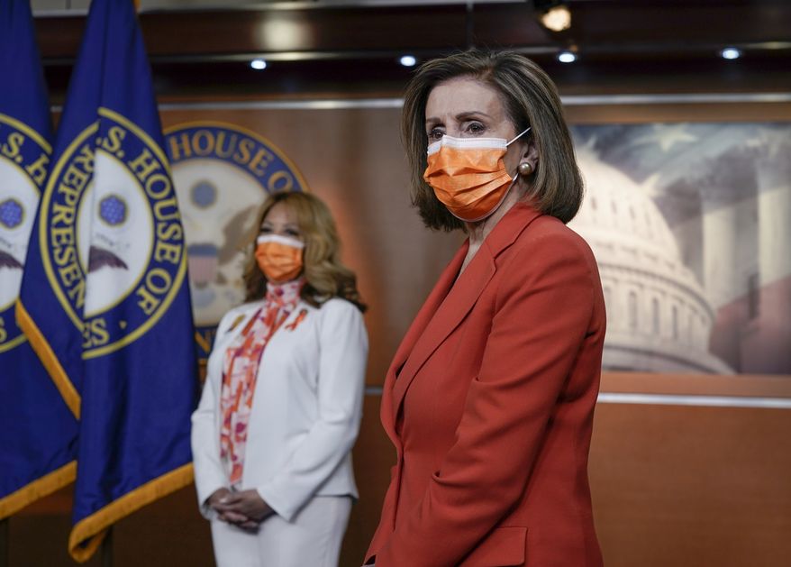 Speaker of the House Nancy Pelosi, D-Calif., joined at left by Rep. Lucy McBath, D-Ga., holds a news conference on passage of gun violence prevention legislation, at the Capitol in Washington, Thursday, March 11, 2021. (AP Photo/J. Scott Applewhite) **FILE**