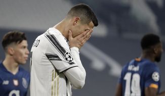 Juventus&#39; Cristiano Ronaldo reacts during the Champions League, round of 16, second leg, soccer match between Juventus and Porto in Turin, Italy, Tuesday, March 9, 2021. (AP Photo/Luca Bruno)