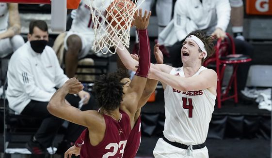 Rutgers&#39; Paul Mulcahy (4) puts up a shot against Indiana&#39;s Trayce Jackson-Davis (23) during the second half of an NCAA college basketball game at the Big Ten Conference tournament, Thursday, March 11, 2021, in Indianapolis. (AP Photo/Darron Cummings)
