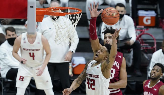 Rutgers&#x27; Jacob Young (42) puts up a shot against Indiana&#x27;s Trayce Jackson-Davis (23) during the second half of an NCAA college basketball game at the Big Ten Conference tournament, Thursday, March 11, 2021, in Indianapolis. (AP Photo/Darron Cummings)