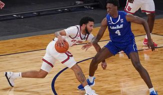 St. John&#39;s guard Julian Champagnie, left, drives against Seton Hall forward Tyrese Samuel (4) during the first half of an NCAA college basketball game in the quarterfinals of the Big East conference tournament, Thursday, March 11, 2021, in New York. (AP Photo/Mary Altaffer)
