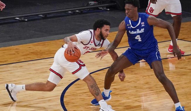 St. John&#x27;s guard Julian Champagnie, left, drives against Seton Hall forward Tyrese Samuel (4) during the first half of an NCAA college basketball game in the quarterfinals of the Big East conference tournament, Thursday, March 11, 2021, in New York. (AP Photo/Mary Altaffer)