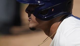 Milwaukee Brewers&#39; Avisail Garcia leads off from first base during the fourth inning of a spring training baseball game against the Chicago Cubs Saturday, March 6, 2021, in Phoenix. (AP Photo/Ashley Landis)