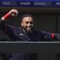 Cleveland Indians&#x27; Billy Hamilton gestures to the Texas Rangers&#x27; dugout before a spring training baseball game Tuesday, March 9, 2021, in Surprise, Ariz. (AP Photo/Sue Ogrocki)