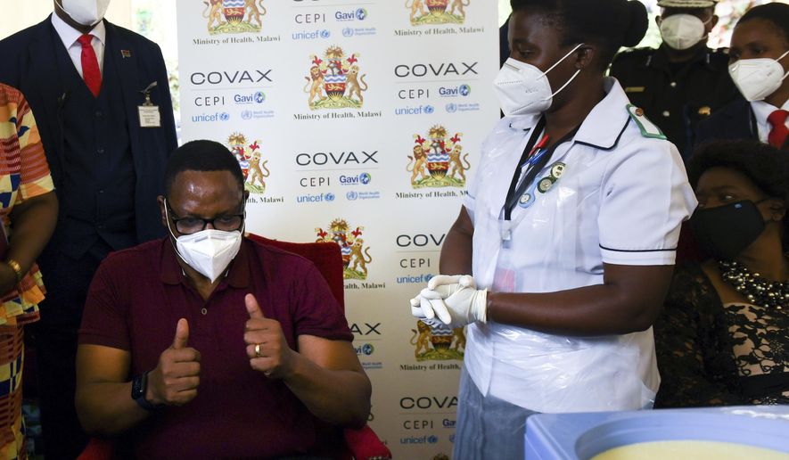 Malawi President, Lazarus Chakwera, gives a thumbs-up after receiving an AstraZeneca COVID-19 vaccine in Zomba, Malawi, Thursday, March 11, 2021. The director of the Africa Centers for Disease Control and Prevention says that as Africa strives to vaccinate 60% of its 1.3 billion people as quickly as possible, the continent must develop its capacity to produce COVID-19 vaccines. (AP Photo/Thoko Chikondi)