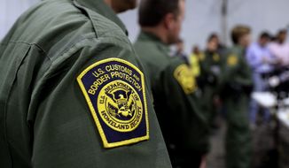 In this Thursday, May 2, 2019, photo, Border Patrol agents hold a news conference prior to a media tour of a new U.S. Customs and Border Protection temporary facility near the Donna International Bridge in Donna, Texas. (AP Photo/Eric Gay) **FILE**