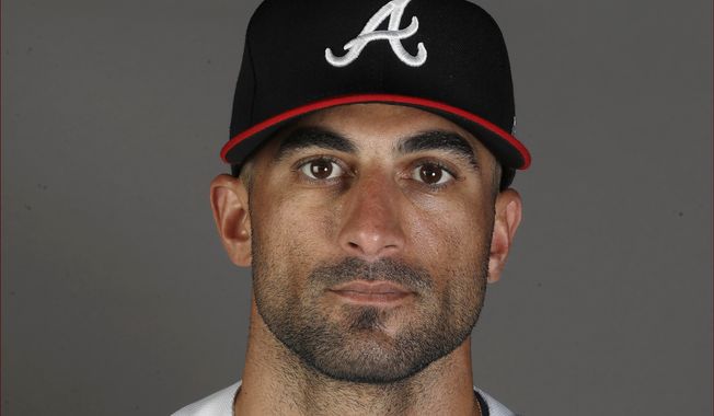 This is a 2020 file photo showing Nick Markakis of the Atlanta Braves baseball team. Markakis has retired after a 15-year career spent with the Atlanta Braves and Baltimore Orioles. The 37-year-old Markakis, who was a free agent, told The Athletic in a story published Friday, March 12, 2021, that he was done playing after accumulating 2,388 hits, earning his lone All-Star bid in 2018 and coming within one win of reaching the World Series in his final season.  (AP Photo/John Bazemore, File)  **FILE**
