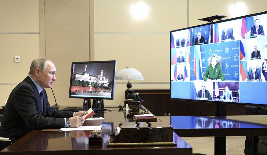 Russian President Vladimir Putin chairs a Security Council meeting via video conference at the Novo-Ogaryovo residence outside Moscow, Russia, Friday, March 12, 2021. (Alexei Druzhinin, Sputnik, Kremlin Pool Photo via AP)