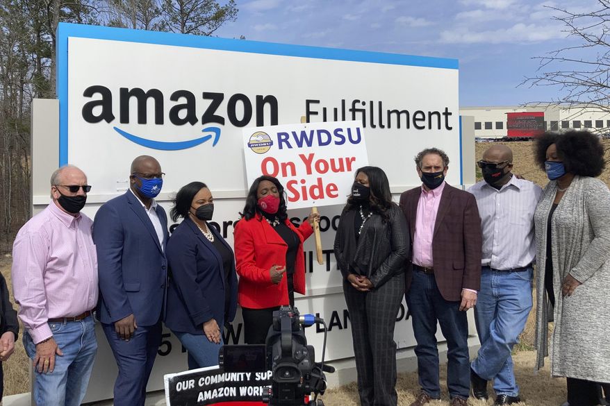 Democratic members of Congress join representatives of the Retail, Wholesale and Department Store Union gather outside an Amazon fulfillment center in Bessemer, Ala., on March 5, 2021, to advocate for the ongoing unionization vote at the sprawling campus. The elected officials pictured include, starting second from left, Rep. Jamaal Bowman of New York, Nikema Williams of Georgia, Terri Sewell of Alabama, Cori Bush of Missouri and Andy Levin of Michigan. (AP Photo/Bill Barrow)