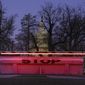 An illuminated traffic barrier is seen on the Capitol grounds before sunrise in Washington, Monday, March 8, 2021. (AP Photo/Carolyn Kaster)