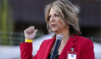 FILE - In this Nov. 18, 2020, file photo, Kelli Ward, chair of the Arizona Republican Party, holds a press conference in Phoenix. Pressure is rising on Ward, the leader of the Arizona Republican Party, to allow an audit of her recent reelection as she continues to question President Joe Biden&#39;s victory in the state. A large group of GOP state lawmakers sent Ward a letter this week demanding that she allow an audit of her January 2021 reelection, which she won by 42 votes, but is increasingly being challenged. (AP Photo/Ross D. Franklin, File)