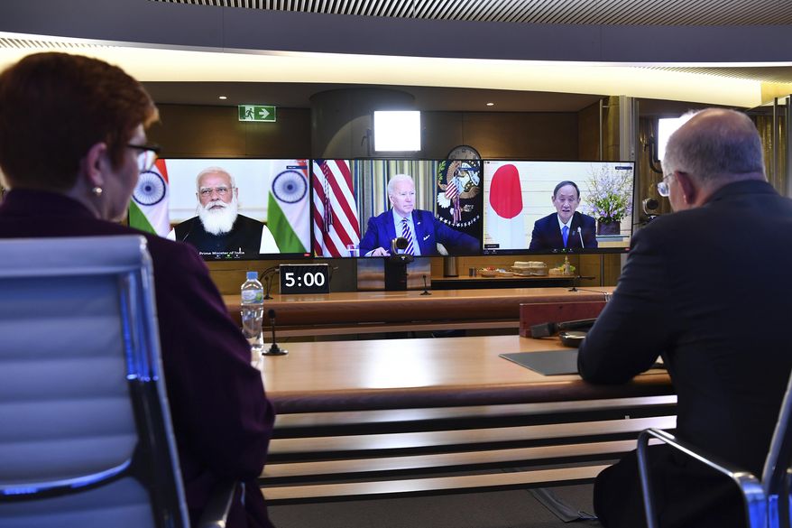 In this file photo, Australia&#x27;s Prime Minister Scott Morrison, right, and Minister for Foreign Affairs Marise Payne, left, participate in the inaugural Quad leaders meeting with the President of the United States Joe Biden, the Prime Minister of Japan Yoshihide Suga and the Prime Minister of India Narendra Modi in a virtual meeting in Sydney, Saturday, March 13, 2021. (Dean Lewins/Pool via AP)  **FILE**