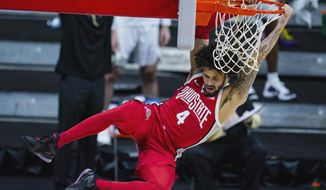 Ohio State guard Duane Washington Jr. (4) follows through on a dunk against Purdue in the first half of an NCAA college basketball game at the Big Ten Conference tournament in Indianapolis, Friday, March 12, 2021. (AP Photo/Michael Conroy)