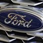 This Feb. 15, 2018, file photo shows a Ford logo on the grill of a 2018 Ford Explorer on display at the Pittsburgh Auto Show. Edsel B. Ford II is retiring from the board of Ford Motor after serving as a board member for 33 years. The automaker also named some other members of the famous family as board nominees. Board nominees will be up for election at Ford&#39;s annual meeting on May 13, 2021. (AP Photo/Gene J. Puskar, File)