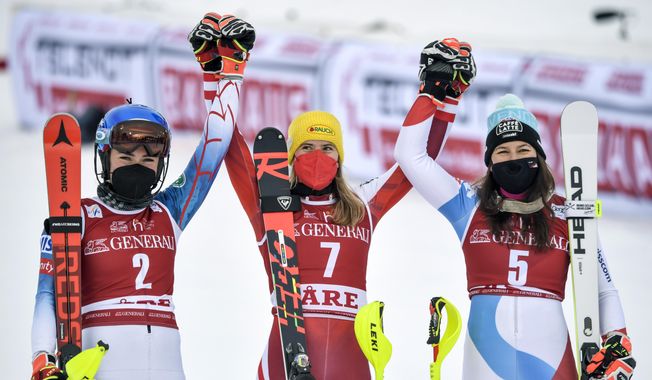 From left, second placed, United States&#x27; Mikaela Shiffrin, winner, Austria&#x27;s Katharina Liensberger and third placed, Switzerland&#x27;s Wendy Holdenercelebrate, after the second run of a Women&#x27;s slalom Alpine World Cup ski race in Are, Sweden, Saturday March 13, 2021. (Pontus Lundahl, TT via AP)