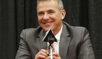 FILE - Then-Ohio State head coach Urban Meyer answers questions during a news conference in Columbus, Ohio, Tuesday, Dec. 4, 2018. Free agency feels a lot like recruiting to new Jaguars coach Urban Meyer. Watching film. Wooing players. Finding the right fits. Given Meyer’s penchant for landing five-star prospects at Florida and Ohio State, Jacksonville could be a popular landing spot for some of the NFL’s top free agents next week. It certainly should help that the Jaguars have more salary cap space (nearly $73 million) than any other team.(AP Photo/Jay LaPrete, File)