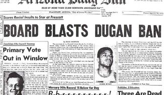 This image shows the front page of the Arizona Daily Sun from Jan. 24, 1964, after Flagstaff High School basketball player James Dugan, center, was suspended for punching a Prescott player. Flagstaff High School principal Tony Cullen contends Dugan reacted to racial prejudice and has circulated a petition that urges the Arizona Interscholastic Association to symbolically rescind the suspension. (Arizona Daily Sun via AP)