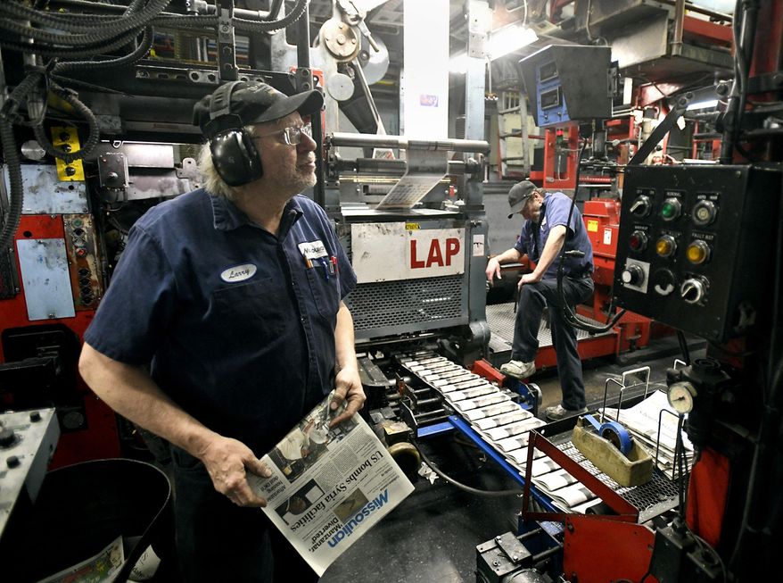 Press operator Larry Sorenson, left, watches the copy counter as he and operator Todd Matthews run the Missoulian press on Feb. 26, 2021 in Missoula, Mont. The press will stop operating at the end of March as printing of the Missoulian moves to the Helena Independent facility in Helena, Mont. (Tom Bauer/The Missoulian via AP)