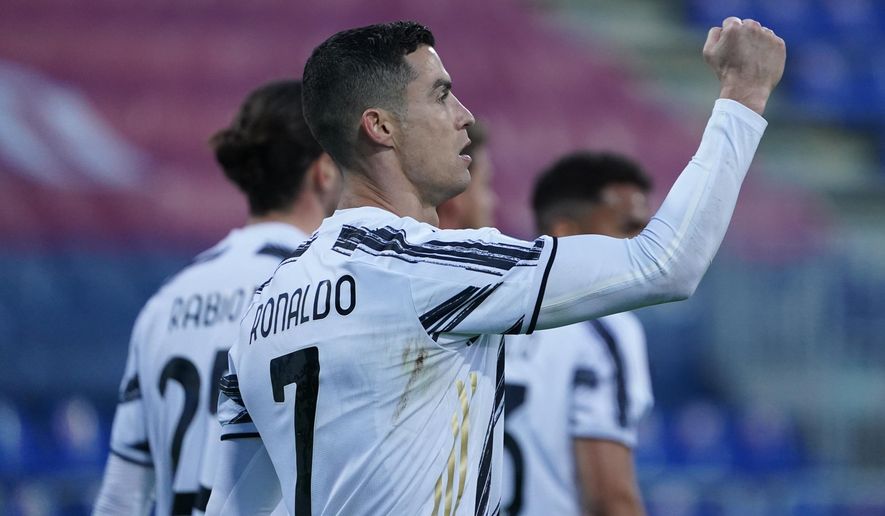 Juventus&#x27; Cristiano Ronaldo celebrates after scoring his side&#x27;s second goal during the Italian Serie A soccer match between Cagliari and Juventus, at the Sardegna Arena stadium in Cagliari, Italy, Sunday, March 14, 2021. (Alessandro Tocco/LaPresse via AP)