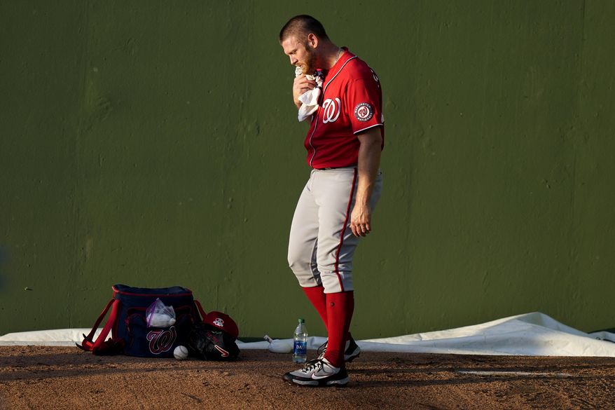 Washington Nationals starting pitcher Stephen Strasburg warms up in the bullpen before a spring training baseball game against the Houston Astros, Tuesday, March 9, 2021, in West Palm Beach, Fla. (AP Photo/Lynne Sladky)