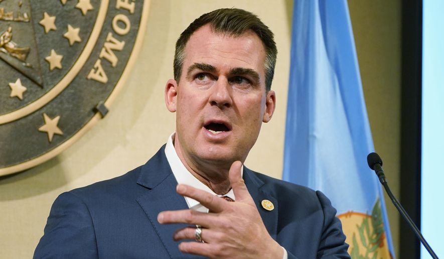 In this Feb. 11, 2021 file photo, Oklahoma Gov. Kevin Stitt speaks during a news conference in Oklahoma City. As the coronavirus swept across Oklahoma and the nation last spring, Gov. Kevin Stitt’s office was inundated with correspondence from frightened residents seeking stricter lockdowns to control the spread of the virus. At the same time, the governor was also weighing requests from dozens of business leaders asking him to make sure their businesses stayed open. (AP Photo/Sue Ogrocki File) **FILE**