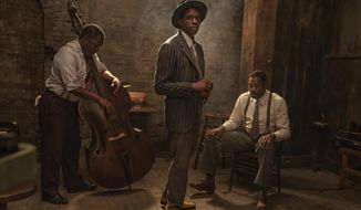 This image released by Netflix shows Michael Potts, from left, Chadwick Boseman and Colman Domingo in &amp;quot;Ma Rainey&#39;s Black Bottom.&amp;quot;  (David Lee/Netflix via AP)